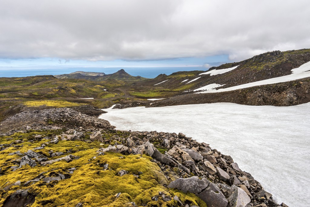 White glacier in a tundra landscape.
